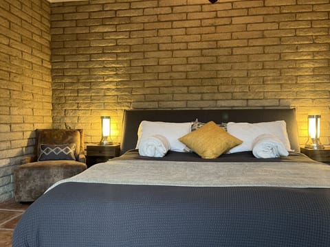 Sink into a king wrapped in cloud-soft layers, where comfort isn’t cozy… it’s ceremonial.