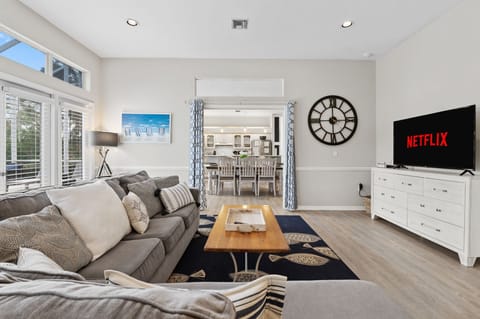 Relax in comfort on the large plush sofa, while enjoying your favorite shows on the 55" smart TV.