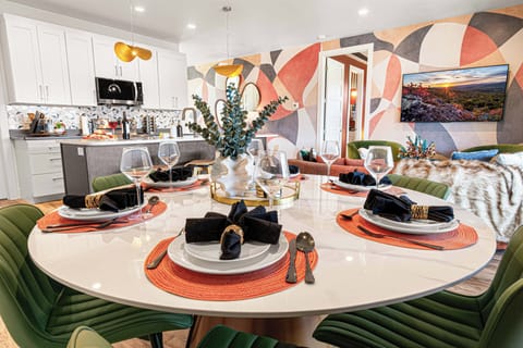 The dining table seats six, plus four more at the kitchen counter—plenty of room for shared meals and conversations.