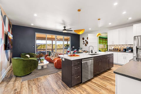 This bright, open-concept layout is perfect for gathering with friends and family. Whether you're sharing a meal, cozying up on the couch, or stepping out onto the deck, the stunning views are always in sight!