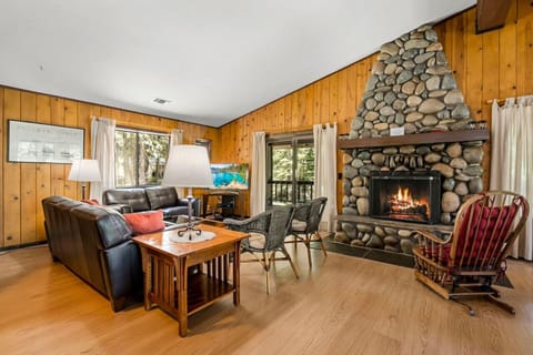 Large Open Great Room (Living Room / Kitchen / Dining) with Wood Burning River Rock Fireplace and Spacious Wrap Around Covered Deck!