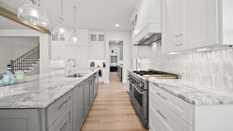 Chef’s kitchen with a double oven, 6-burner stove, built-in griddle, and oversized fridge — fully stocked and ready for the best