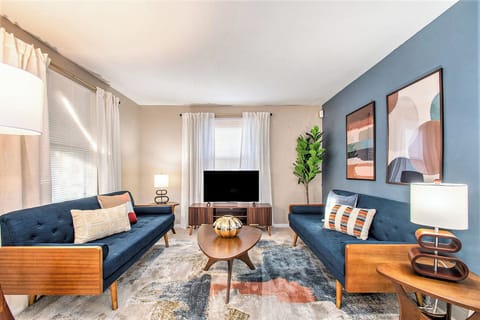 Cozy living room with 2 plush couches, TV, and elegant vibes