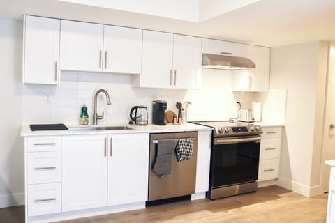 Fully equipped kitchen with modern appliances and ample counter space.