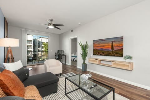 Stylish living room with comfortable double sofa bed, working station, dining area.