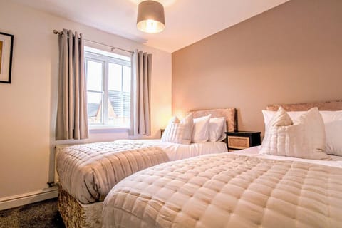 Bedroom 1 with a comfortable zip link bed which is configured as two single beds by default or can be zipped together to form a king-size bed upon request. Fresh linen and towels are provided.