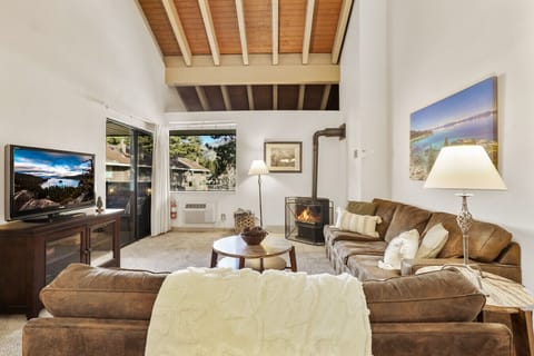 Living room with Smart TV & gas fireplace. Slider to patio.