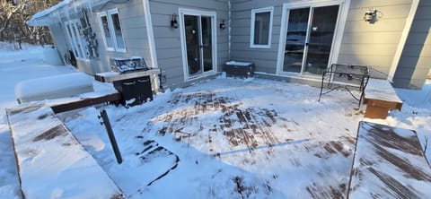 weber grill right outside of the kitchen