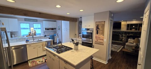 double ovens to help with feeding a large group, & a propane weber right outside