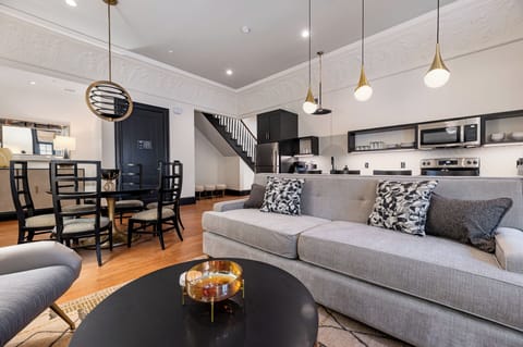 Step into history in this two-story unit, once a bustling 1920s dance hall and music store. The beautifully preserved interiors and crown molding create an unforgettable ambiance for group stays.