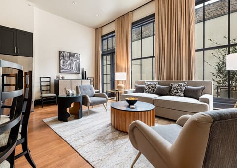 Ideal for group gatherings, this unit combines indoor luxury with a spacious private patio. High ceilings and large windows ensure a light-filled environment.