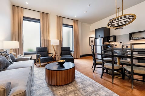 This elegantly furnished living and dining area offers a stylish escape in the heart of the city.