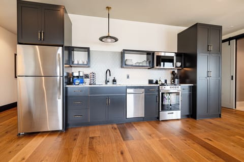 Fully equipped kitchen with modern appliances, offering everything you need for preparing meals or enjoying a morning coffee.