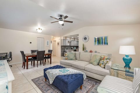 Spacious living room, dining room, dedicated workspace, and kitchen