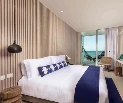 Sink into crisp bedding with soothing ocean views.