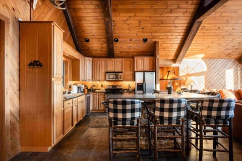 Chef's kitchen, open to living room, bar seating for 6. Flows to diningroom