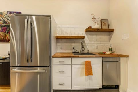 A sleek, modern fridge perfect for storing your essentials during your stay.