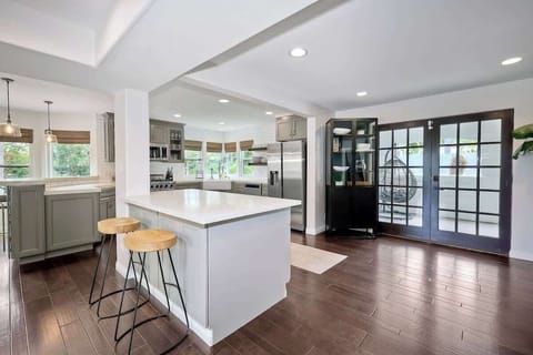 Fully stocked open chefs kitchen with tons of natural light