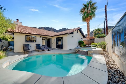 Modern open concept pool/jacuzzi home with front grass yard