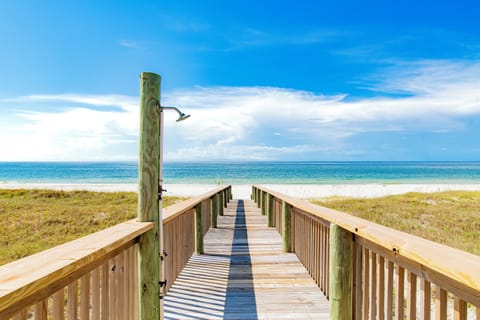Private boardwalk directly to the sugary-white sand