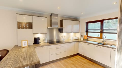A fully equipped modern kitchen with all the appliances needed for a family holiday.