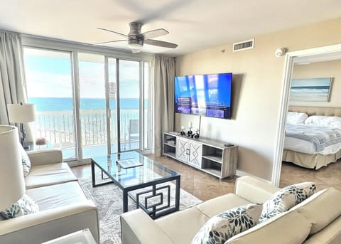 Spacious living room with a stunning Gulf view and modern furniture.