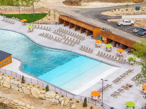 Resort-style pool with cabanas and loungers. Zero entry!