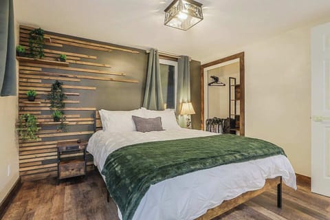 Luggage racks - Hangers & shelving for clothing  - USB and outlet Charging Station on nightstand - Custom accent wall with plants