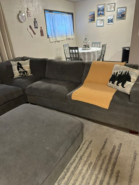 L- shaped sectional couch. with cushion ottoman. 