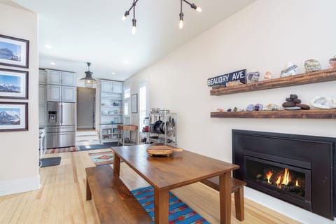 A fireplace by the dining table of this holiday home in Telluride.