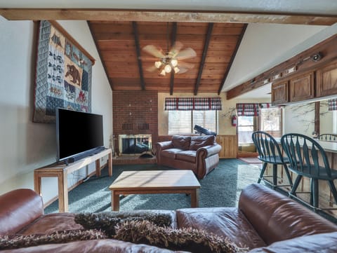 View of the spacious living room featuring comfortable seating, a warm and inviting atmosphere, and plenty of space to relax after a day of adventure.