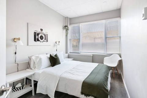 The bedroom offers a luxurious retreat, with a bed that promises restful nights and a room that feels like a private oasis.