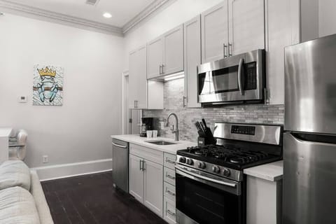 Kitchen featuring gas oven and stainless steel appliances.