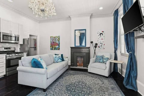 Open Concept Living, Dining and Kitchen area with sofa bed. 