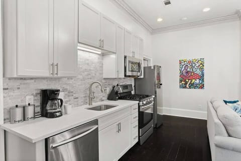 Kitchen featuring gas oven and stainless steel appliances.