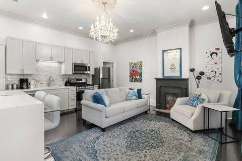 Open Concept Living, Dining and Kitchen area with sofa bed. 