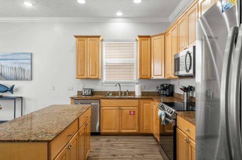 The open kitchen offers ample space & all the comforts of home