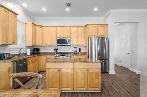 The open kitchen offers ample space & all the comforts of home