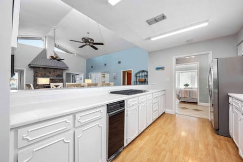 The upper-level’s airy kitchen offers ample space & all the comforts of home