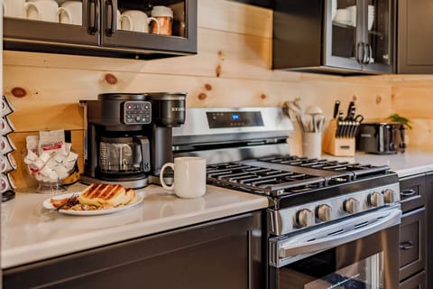 Kuerig coffee maker, K cups and creamer provided. 