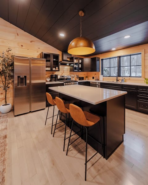 Open kitchen and large island with seating  for 3.