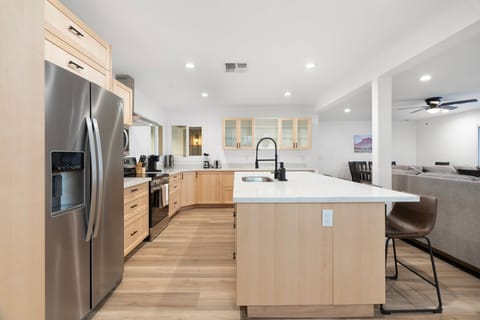 Features a large fridge and plenty of cabinetry, making meal prep a breeze.