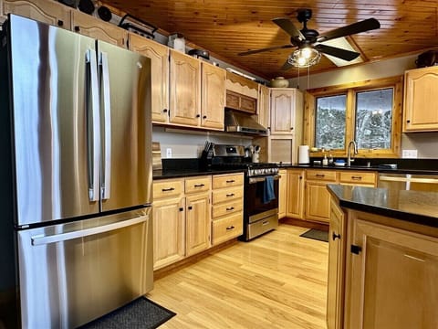A warm inviting kitchen with upgraded appliances. Ideal for those who enjoy cooking.