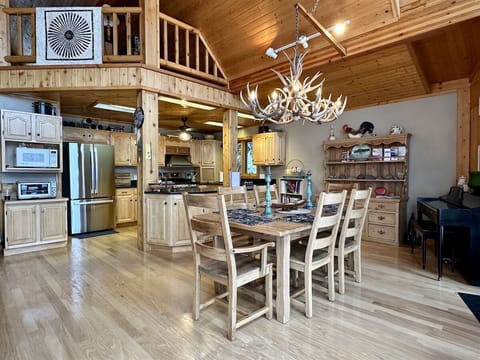 Open floor plan, dining area with country aesthetic.