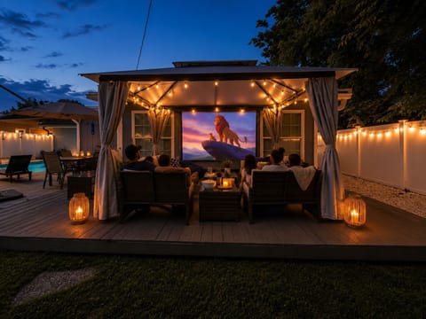The ultimate backyard movie night awaits! Cozy up under the stars in your private outdoor theater, complete with comfortable seating, ambient lighting, and a big-screen experience. Perfect for unforgettable family movie nights, relaxing evenings