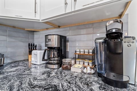Enjoy a fresh brew anytime with our dedicated coffee station—complete with Keurig, drip machine, toaster, and mugs for the whole family. Your perfect home-away-from-home convenience. #FamilyFriendlyStay #BradentonRental
