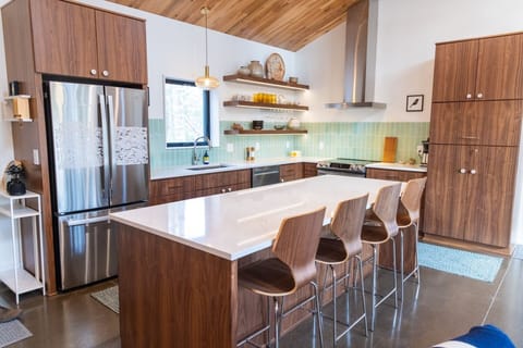 Island seating for 4 and a huge kitchen work surface.