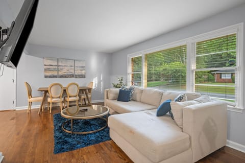 Relax in open concept living room area and dining area.