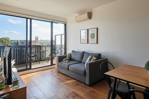 The light-filled living area offers a sofa to settle in with some TV, while split system air conditioning and heating ensure year-round comfort. 
