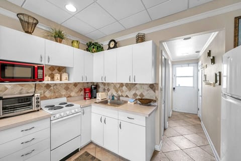 Clean, functional kitchen layout w/ modern appliances and plenty of storage.